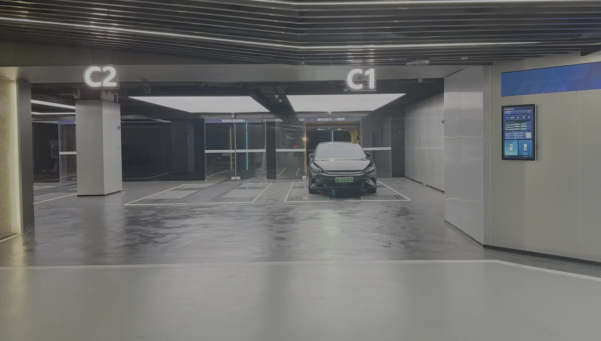 Automated smart parking facility with electric vehicle entering an autonomous parking and charging bay