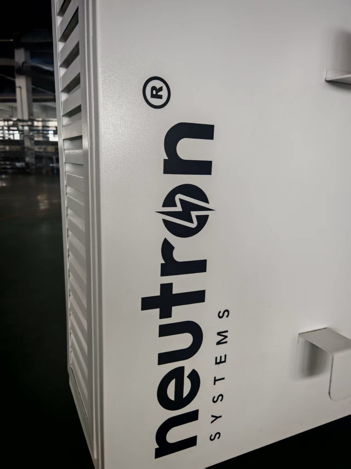 Close-up of Neutron NSNF0042 side panel showing louvred ventilation and Neutron Systems branding
