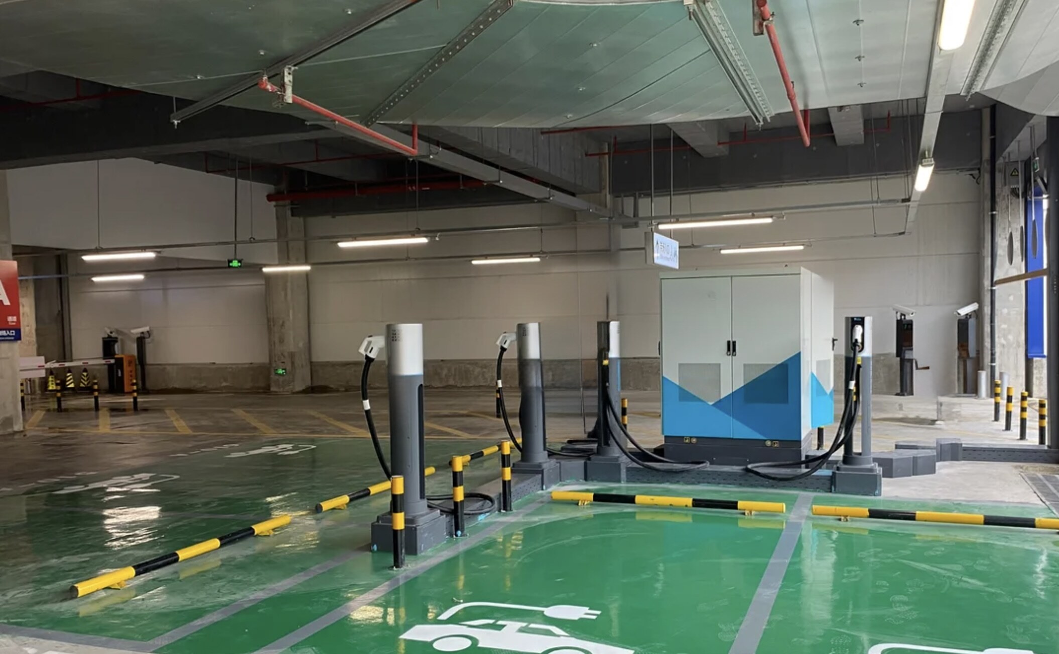Neutron NSNF0010DC rapid deployment dispenser units surface-mounted to concrete floor in a covered fleet depot